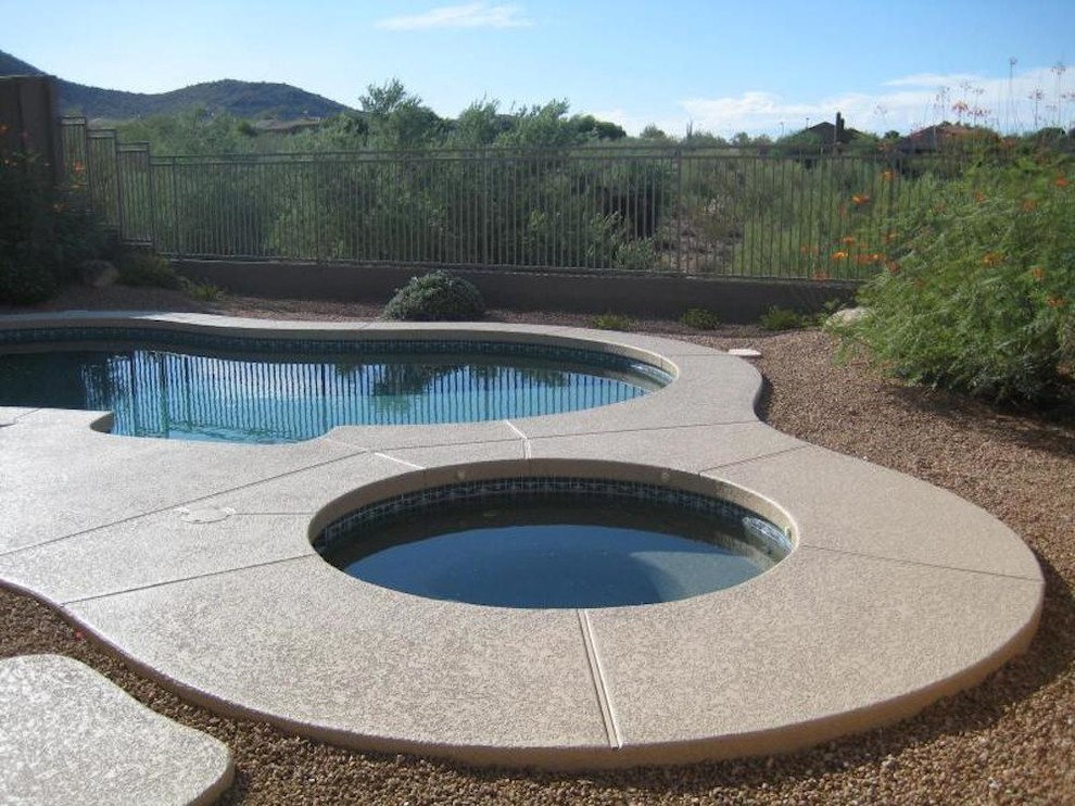 Example of a mid-sized backyard kidney-shaped pool design in Phoenix