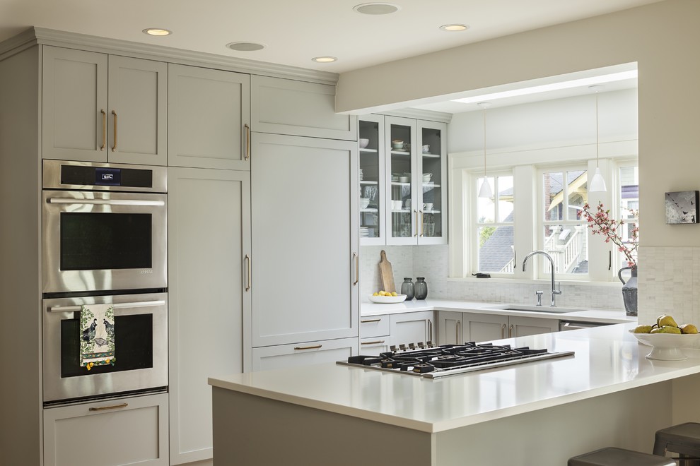 Photo of a transitional kitchen in Vancouver with a peninsula.
