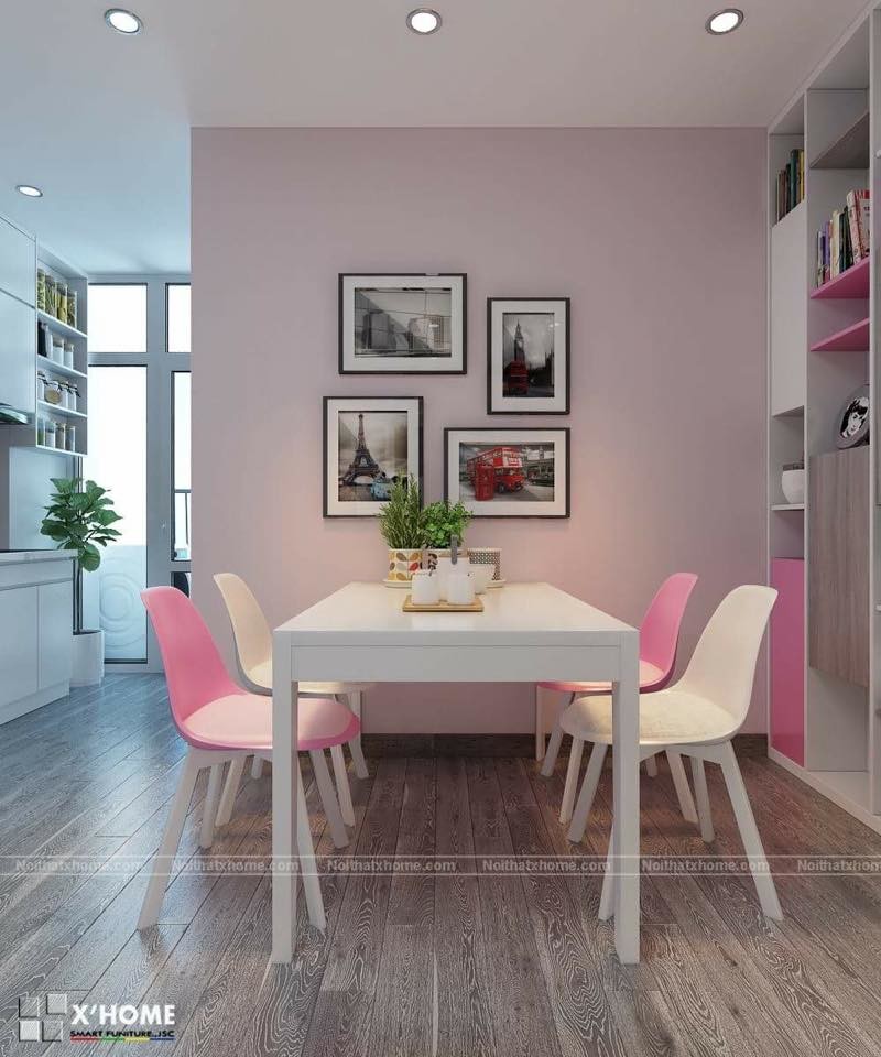 Cette photo montre une petite salle à manger moderne fermée avec un mur rose, un sol en brique, une cheminée d'angle et un manteau de cheminée en brique.