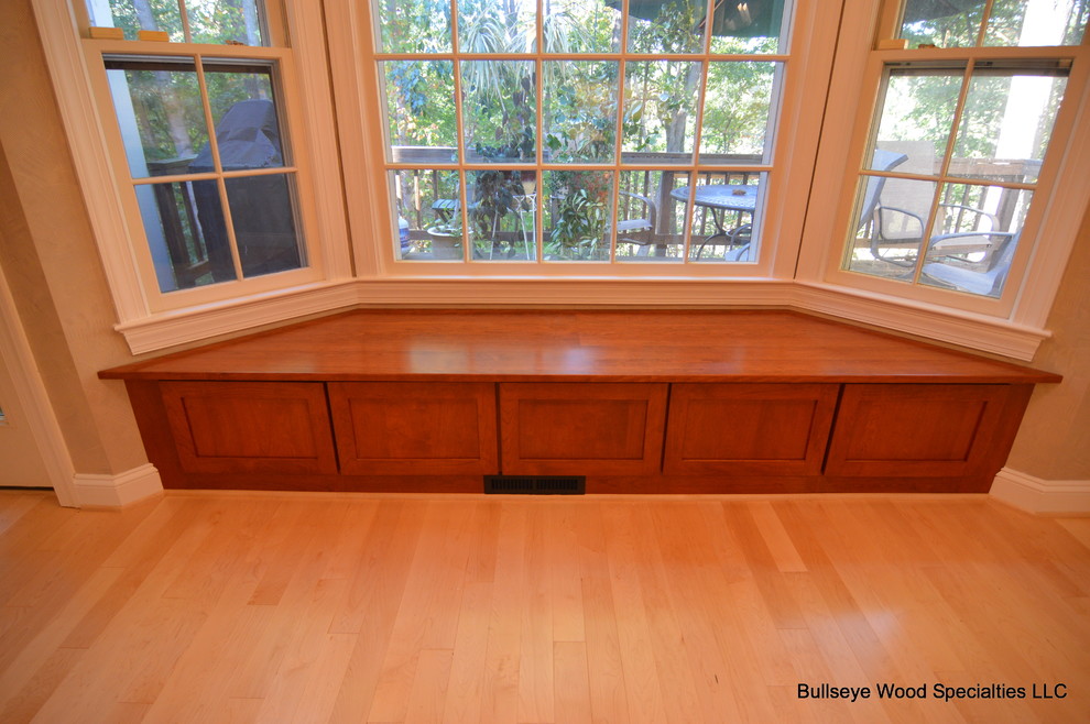 Example of a large transitional u-shaped light wood floor and beige floor eat-in kitchen design in DC Metro with an undermount sink, shaker cabinets, medium tone wood cabinets, granite countertops, white backsplash, subway tile backsplash, stainless steel appliances and an island