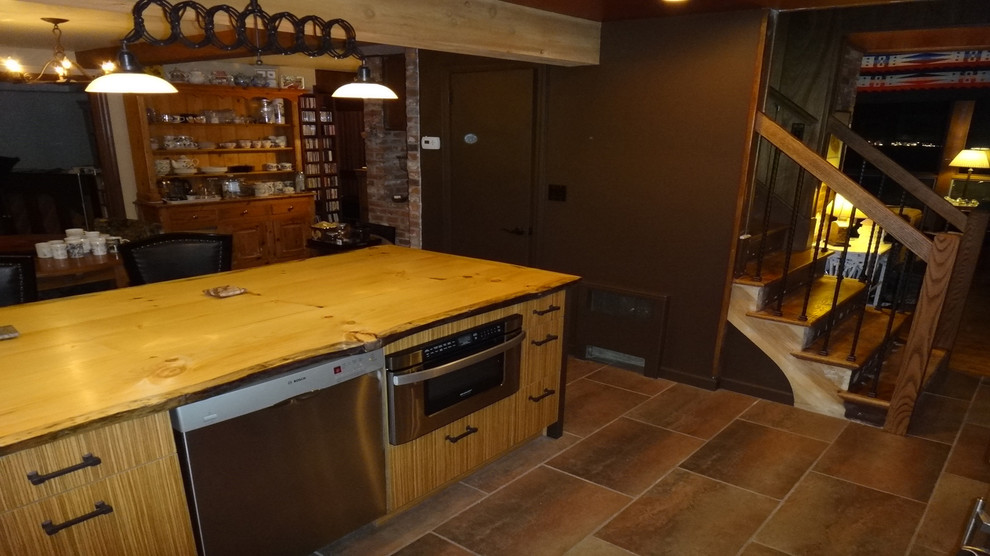 Kitchen - mid-sized rustic kitchen idea with medium tone wood cabinets, wood countertops, metallic backsplash and an island