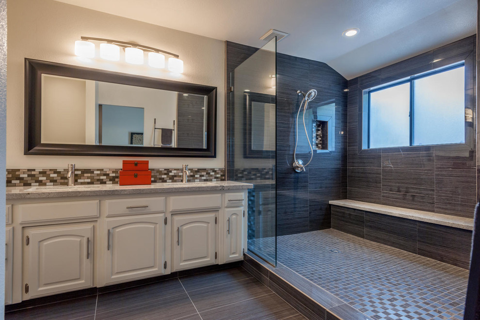Mid-sized transitional master porcelain tile porcelain tile and gray floor doorless shower photo with raised-panel cabinets, white cabinets, white walls, an undermount sink, granite countertops and gray countertops