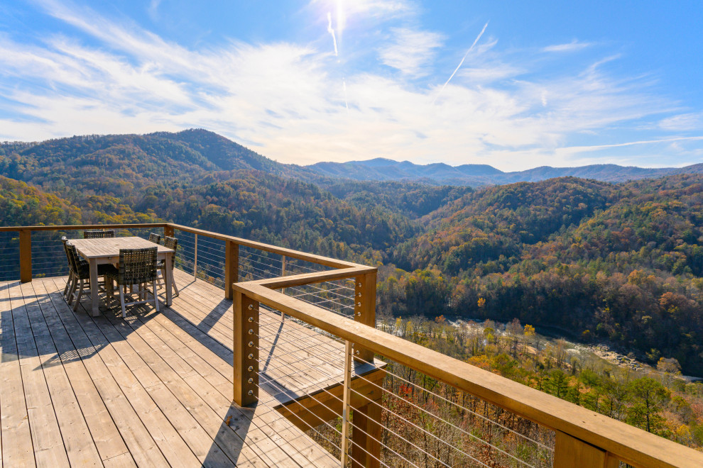 Inspiration for a transitional backyard deck remodel with no cover