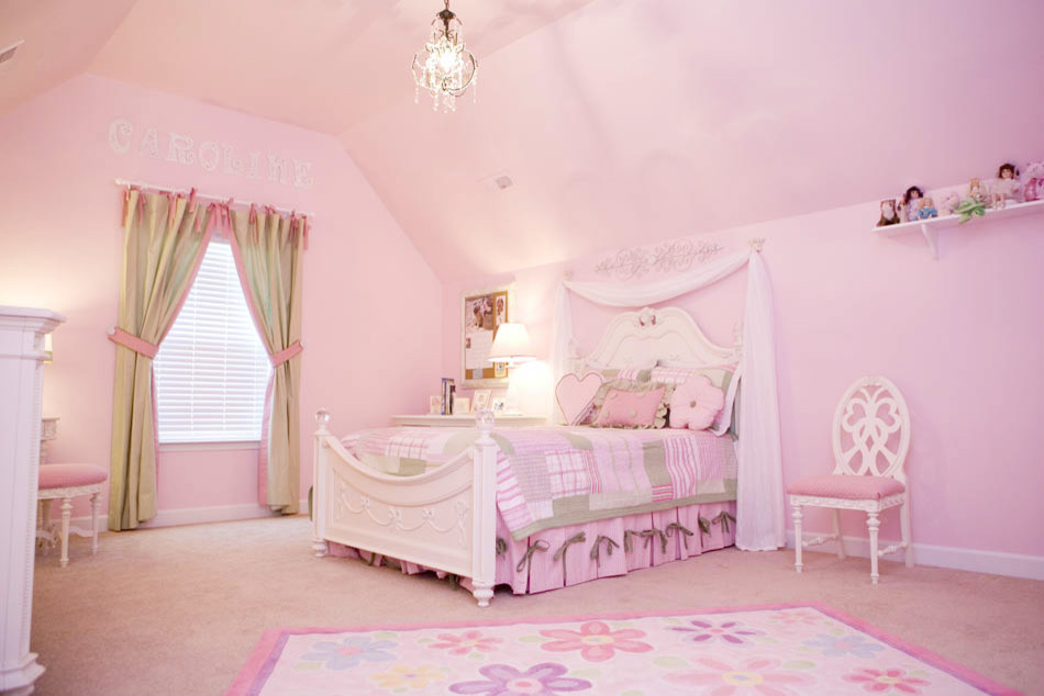 Design ideas for a large traditional kids' bedroom for kids 4-10 years old and girls in Other with pink walls and carpet.