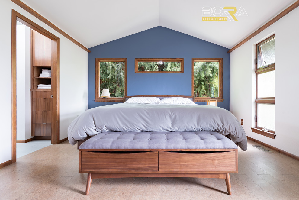 Photo of a mid-sized transitional master bedroom in Seattle with blue walls, linoleum floors, no fireplace and beige floor.