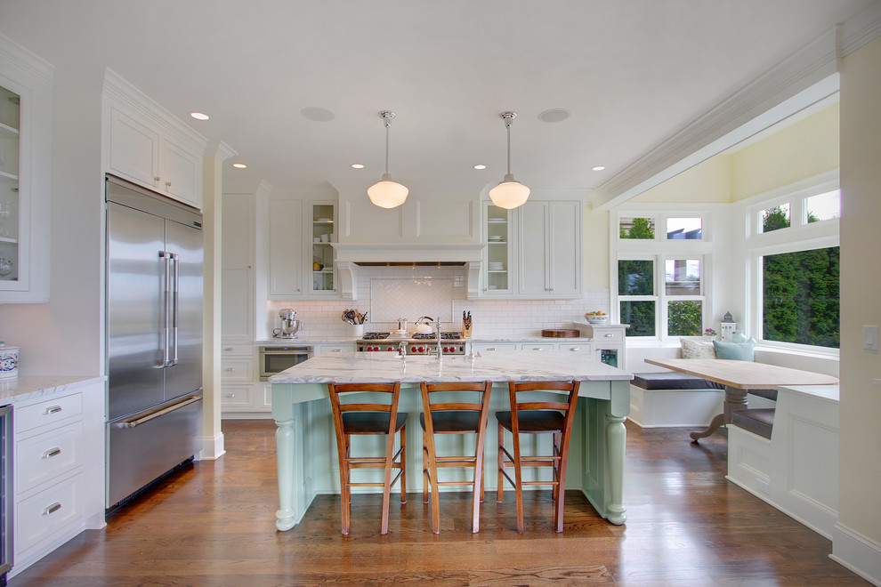 Photo of an arts and crafts kitchen in Seattle with marble benchtops and stainless steel appliances.