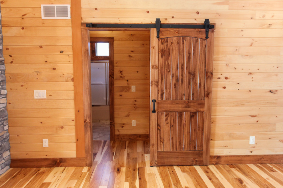 Mountain style light wood floor, yellow floor, wood ceiling and wood wall hallway photo