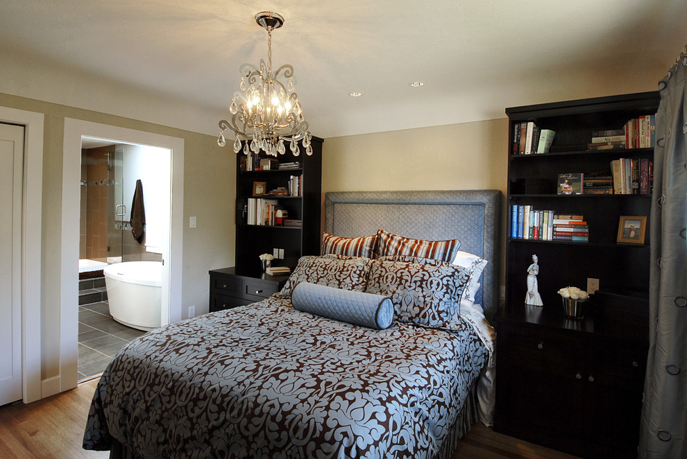 Inspiration for a contemporary master bedroom in Vancouver with beige walls and medium hardwood floors.