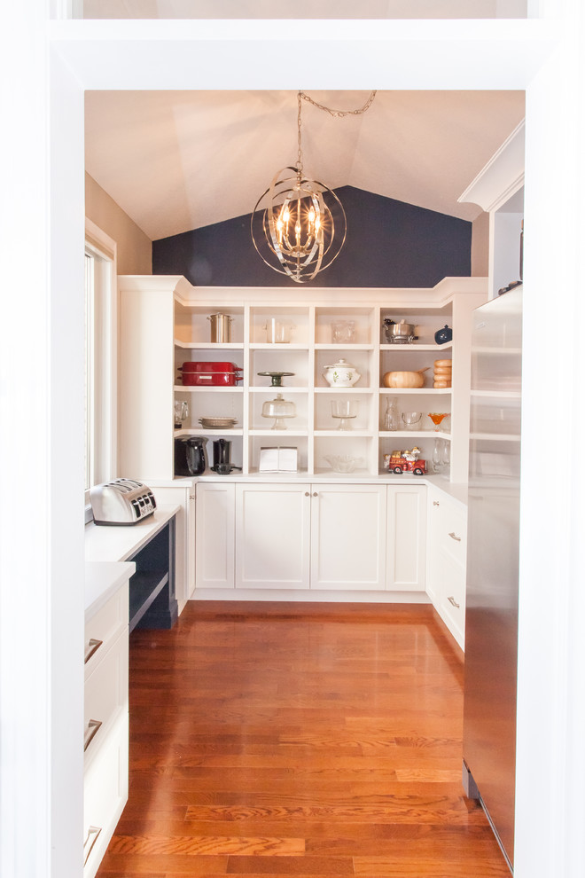 Large transitional u-shaped dark wood floor and brown floor kitchen pantry photo in Toronto with recessed-panel cabinets, white cabinets, quartz countertops, gray backsplash, stainless steel appliances, an island and white countertops