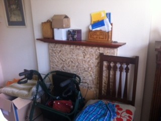 Decluttered reception room used as a storage room