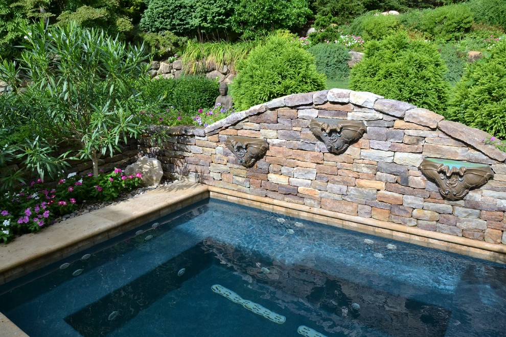 Small modern rectangular pool in New York with a hot tub.