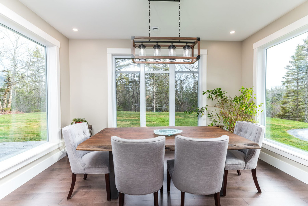Inspiration for a small transitional medium tone wood floor and brown floor enclosed dining room remodel with beige walls