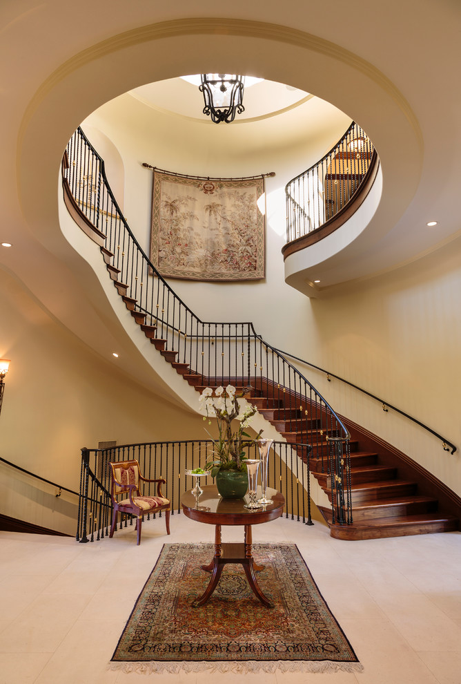 Design ideas for an expansive mediterranean wood curved staircase in Los Angeles with open risers.