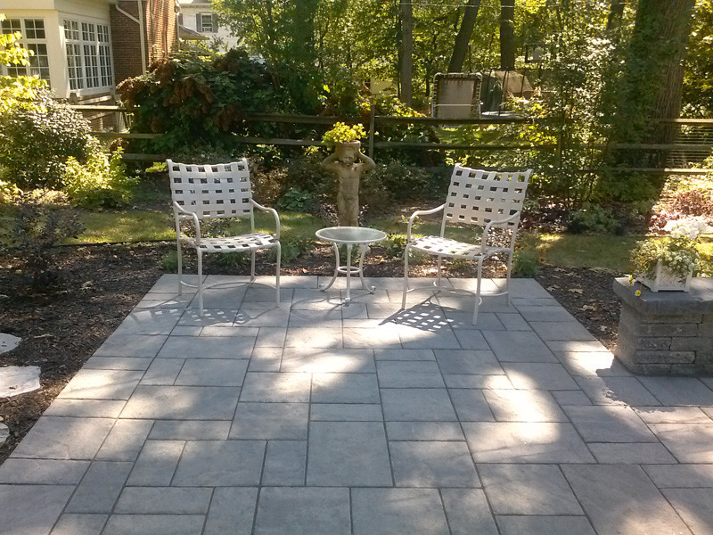 Photo of a small traditional backyard patio in Baltimore with concrete pavers.