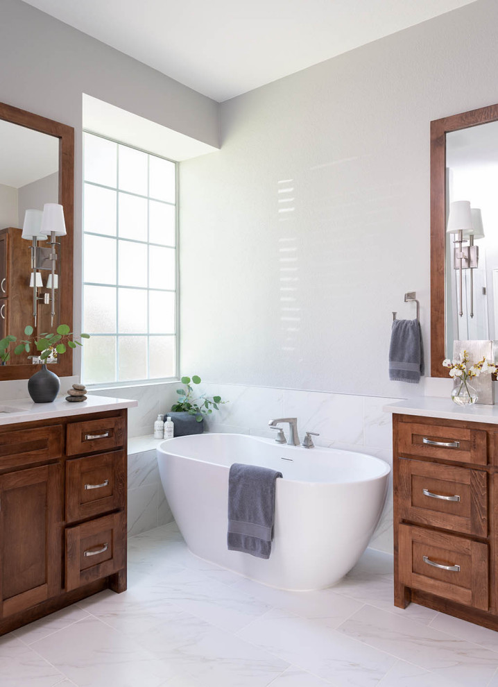 Inspiration for a mid-sized traditional master bathroom in Dallas with shaker cabinets, medium wood cabinets, a freestanding tub, grey walls, an undermount sink, white floor, white benchtops, a built-in vanity and a double vanity.