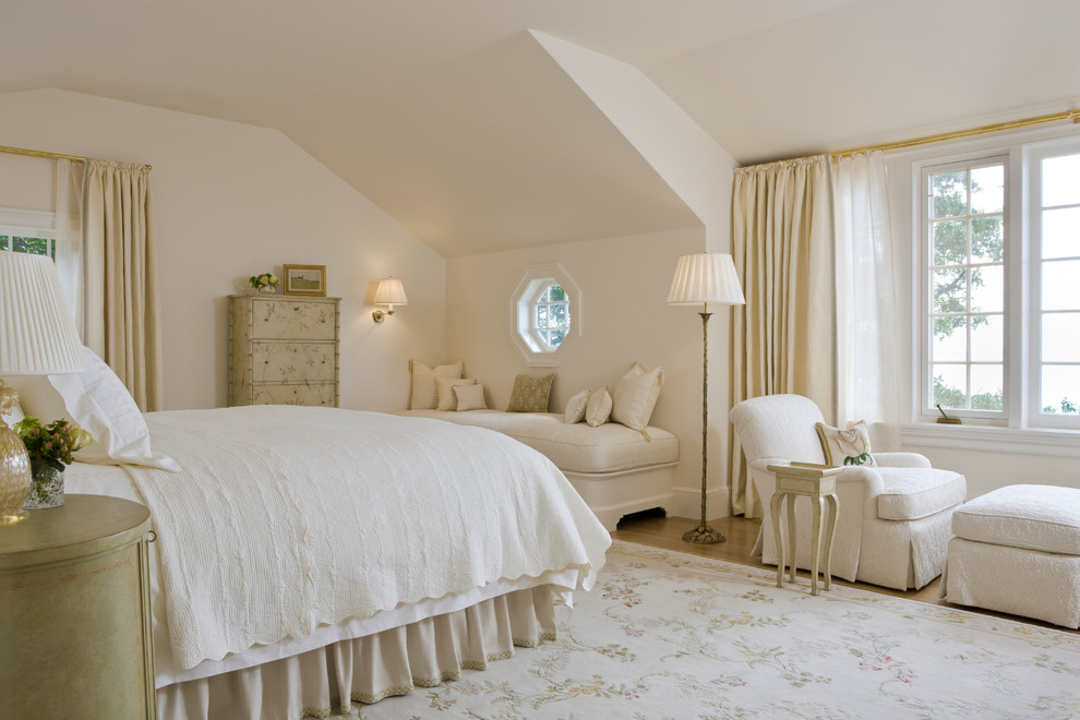 Design ideas for a traditional master bedroom in Boston with beige walls, light hardwood floors and no fireplace.