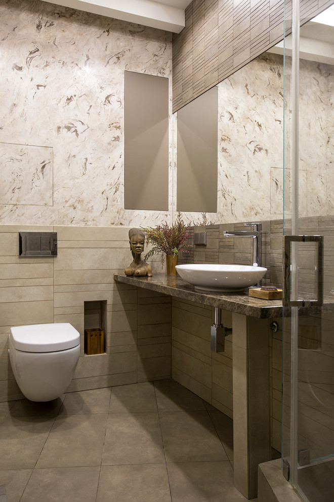Mid-sized contemporary 3/4 bathroom in Moscow with a corner shower, a wall-mount toilet, brown tile, brown walls, a vessel sink, brown floor and a hinged shower door.