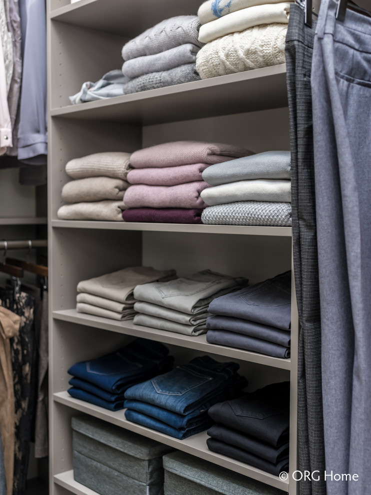 Inspiration for a mid-sized transitional gender-neutral carpeted and beige floor walk-in closet remodel with flat-panel cabinets and gray cabinets