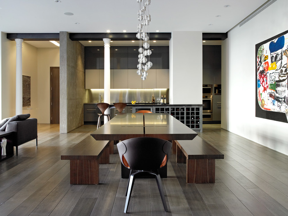 Photo of a large contemporary dining room in New York with white walls and light hardwood floors.