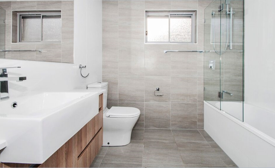 Inspiration for a modern bathroom in Brisbane with flat-panel cabinets, medium wood cabinets, a corner shower, brown tile, travertine, ceramic floors, an integrated sink, beige floor and a hinged shower door.