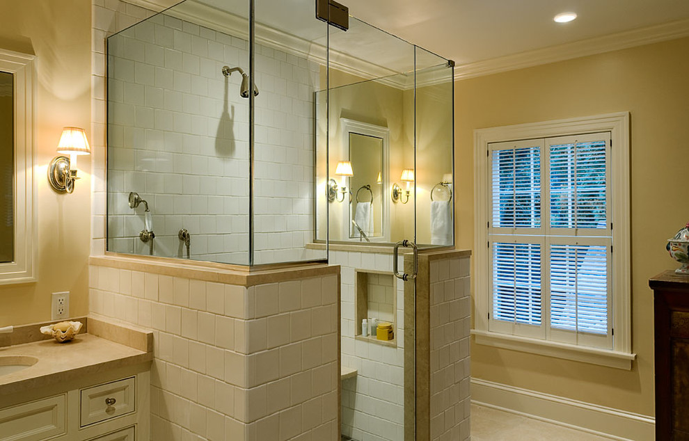 This is an example of a traditional bathroom in New York with an undermount sink and subway tile.