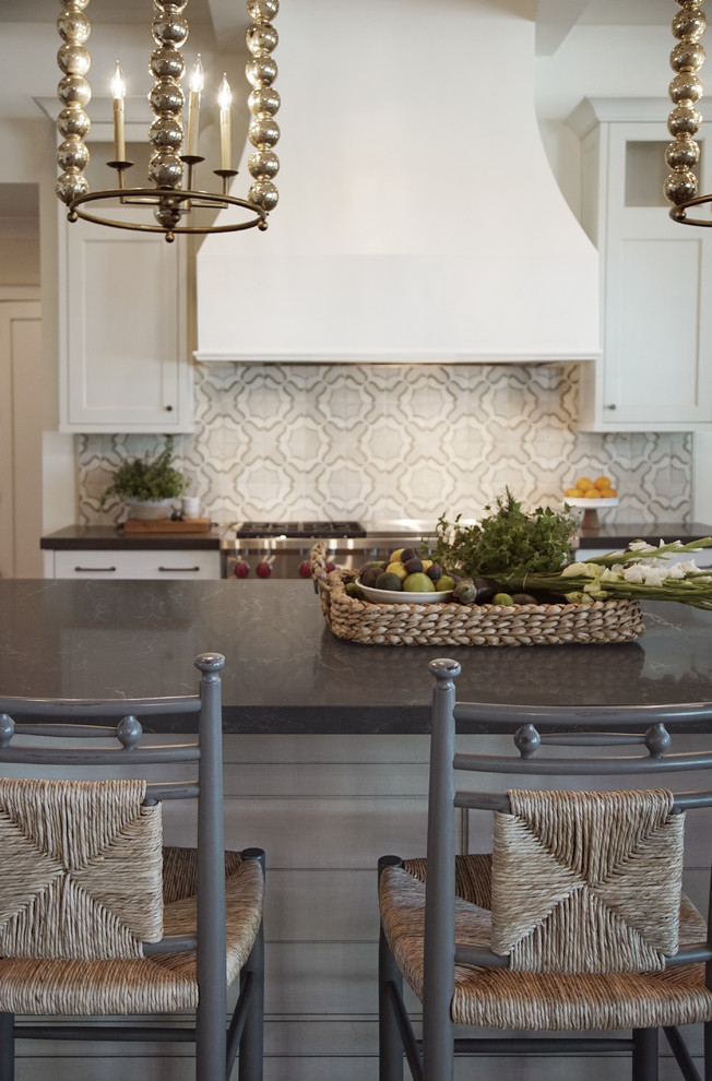 Example of a large transitional u-shaped medium tone wood floor, brown floor and wood ceiling open concept kitchen design in Phoenix with a farmhouse sink, shaker cabinets, gray cabinets, quartz countertops, multicolored backsplash, terra-cotta backsplash, stainless steel appliances, an island and black countertops