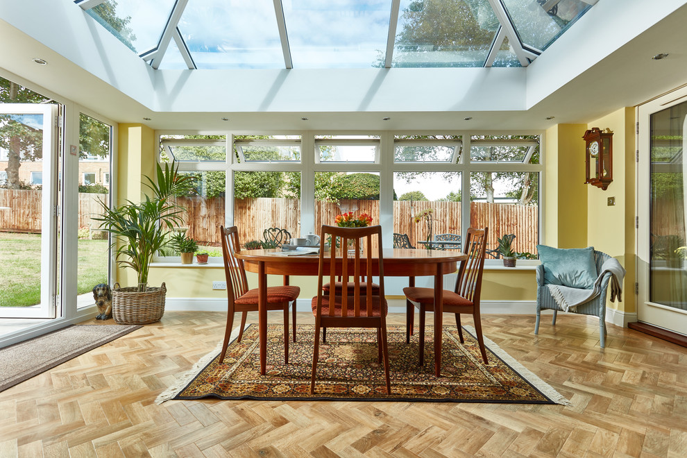 Inspiration for a transitional sunroom in Other with a skylight and beige floor.