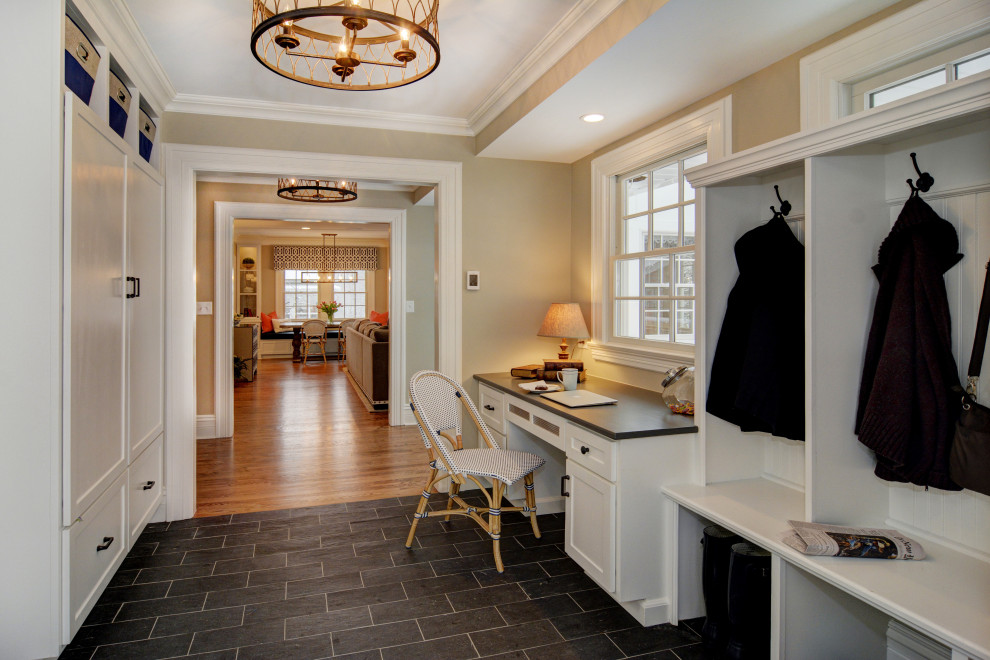 Design ideas for a large traditional mudroom in Newark with beige walls, porcelain floors, grey floor and recessed.
