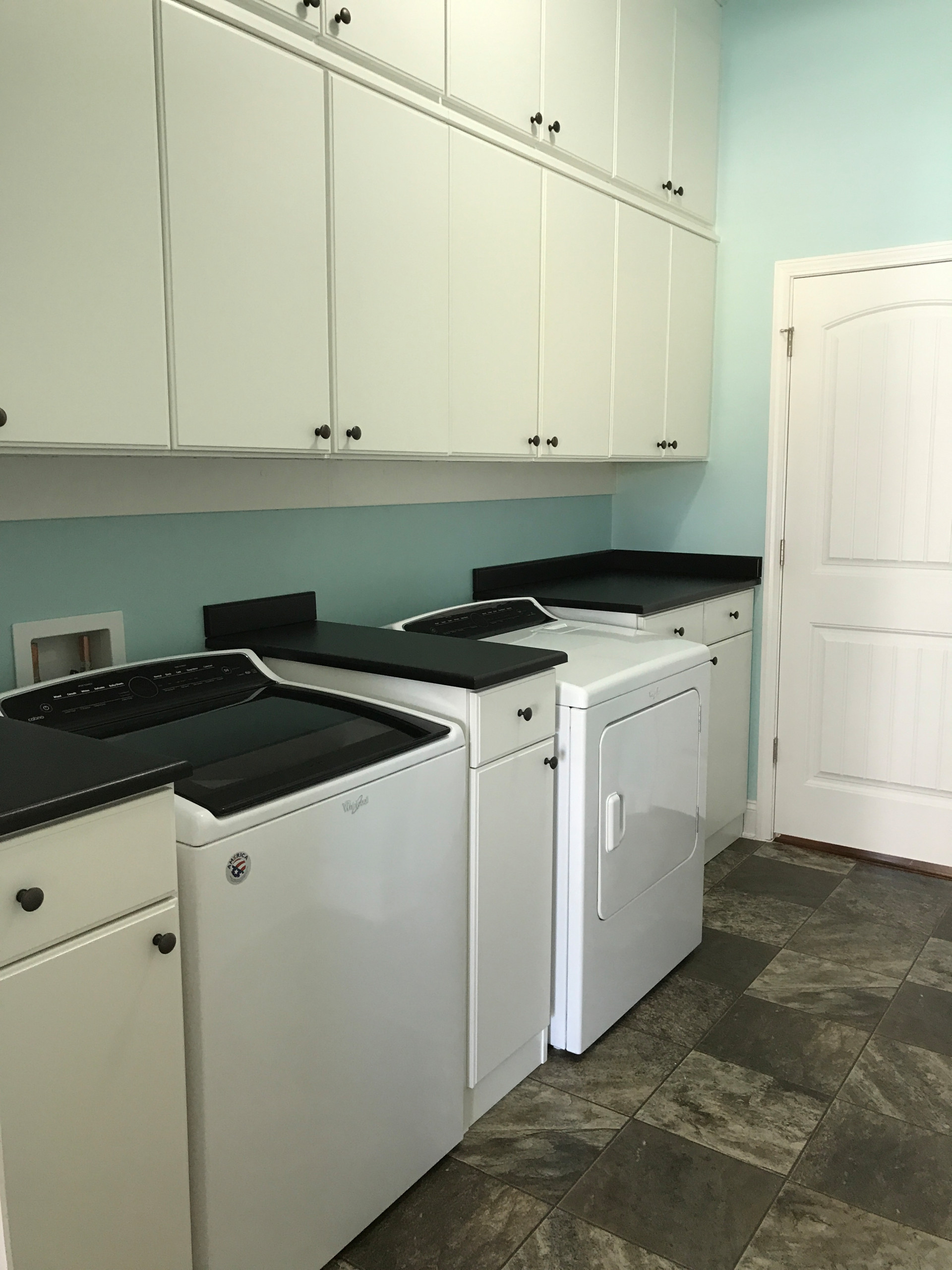 Laundry Room with Wall-Hung Cabinets and Counter Space