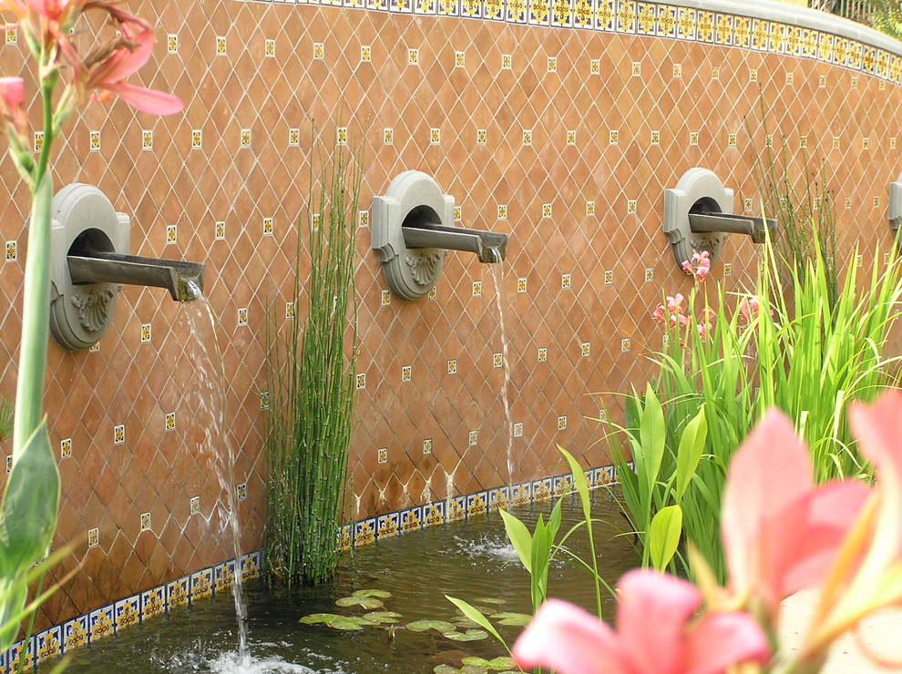 Photo of a mediterranean garden in Santa Barbara with a water feature.