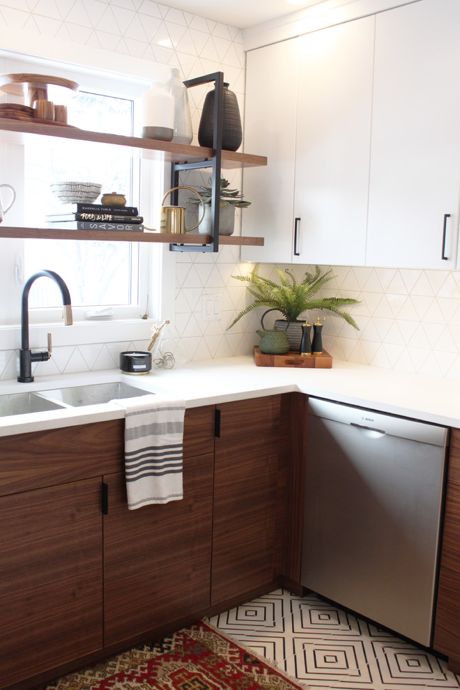 Inspiration for a mid-sized midcentury u-shaped separate kitchen in Other with an undermount sink, flat-panel cabinets, quartz benchtops, white splashback, ceramic splashback, stainless steel appliances, cement tiles, a peninsula, white floor and white benchtop.