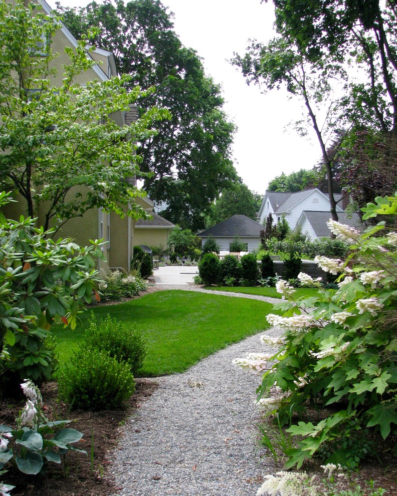 Inspiration for a mid-sized contemporary partial sun backyard stone formal garden in Sacramento for summer.