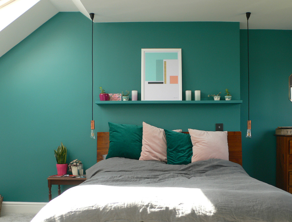 Photo of a contemporary bedroom in Cambridgeshire with green walls.