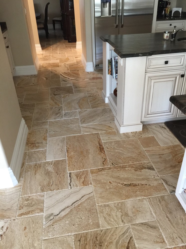 Example of a small transitional travertine floor and beige floor hallway design with beige walls