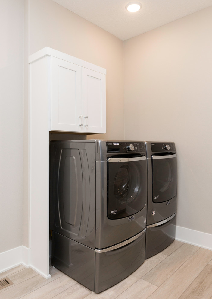 This is an example of a contemporary laundry room in Other.