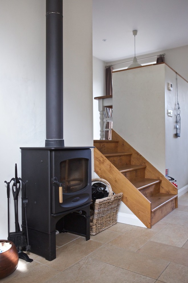 Inspiration for a mid-sized contemporary wood straight staircase in Wiltshire with wood risers.