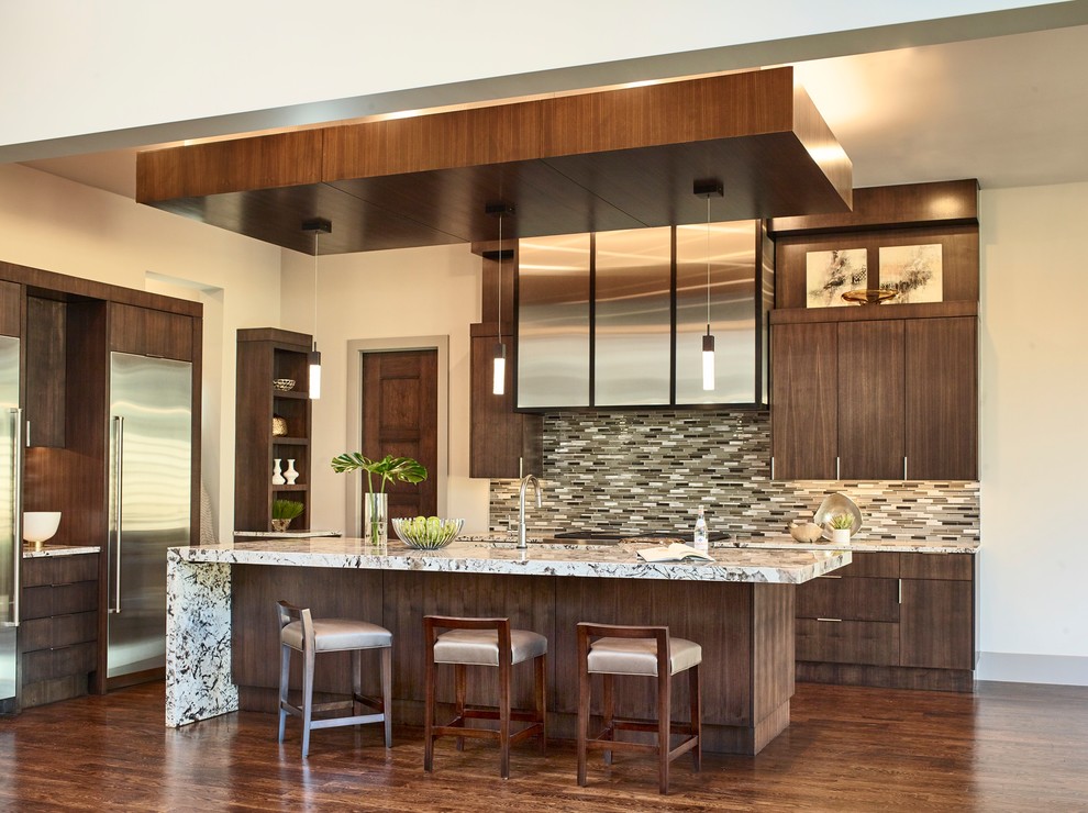 Design ideas for a contemporary kitchen in Dallas with flat-panel cabinets, dark wood cabinets, multi-coloured splashback, matchstick tile splashback, stainless steel appliances, medium hardwood floors and with island.
