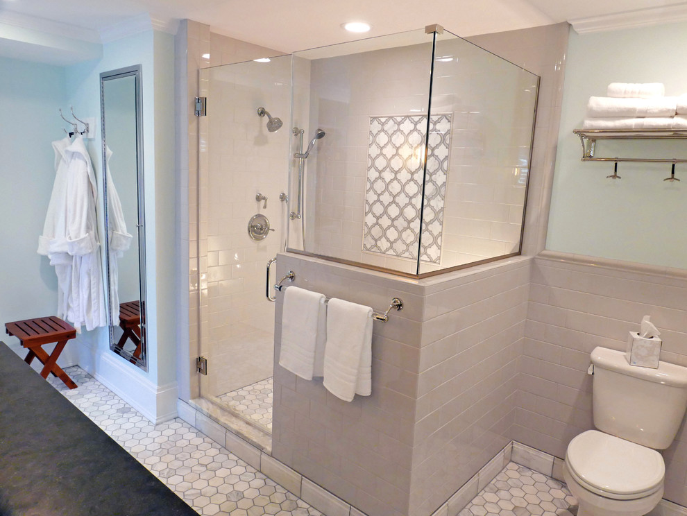 Design ideas for a mid-sized traditional master bathroom in Cleveland with furniture-like cabinets, dark wood cabinets, a corner shower, a two-piece toilet, gray tile, subway tile, porcelain floors, an undermount sink, granite benchtops, green walls, white floor and a hinged shower door.
