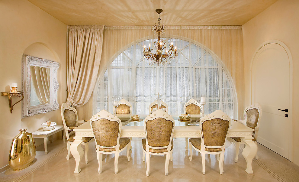 This is an example of a traditional dining room in Other with beige walls and marble floors.