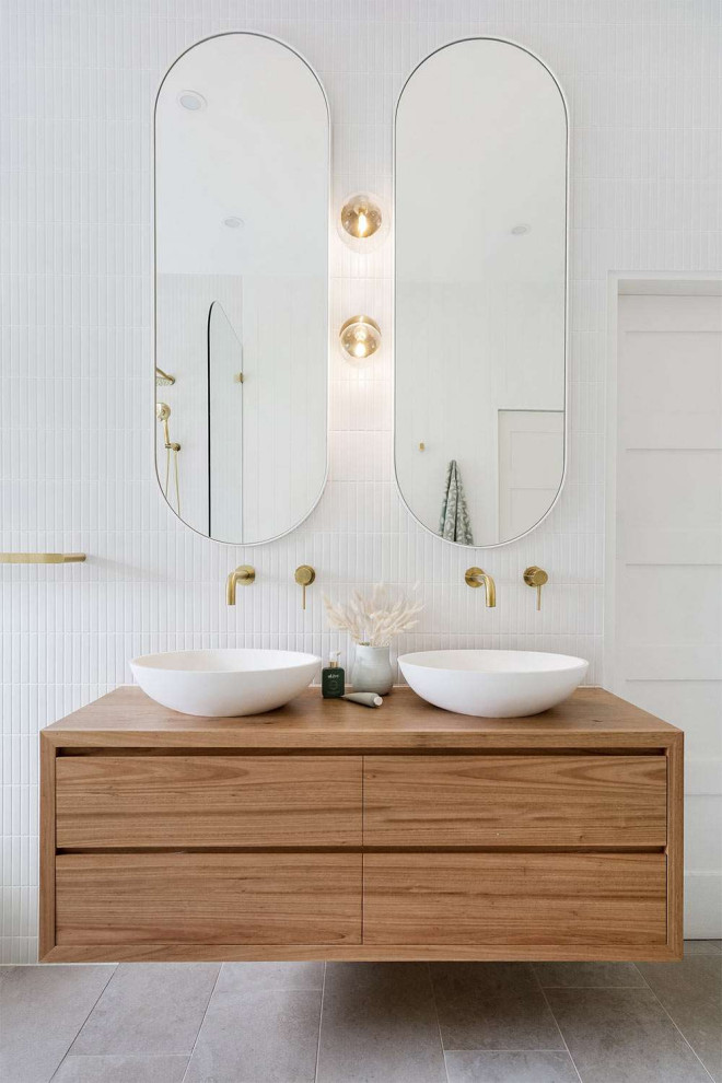 Design ideas for a large contemporary master wet room bathroom in Perth with dark wood cabinets, a freestanding tub, white tile, matchstick tile, white walls, porcelain floors, a vessel sink, wood benchtops, grey floor, an open shower, brown benchtops, a double vanity, a floating vanity, exposed beam, planked wall panelling and flat-panel cabinets.