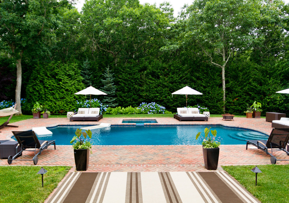 This is an example of a traditional pool in New York with brick pavers.