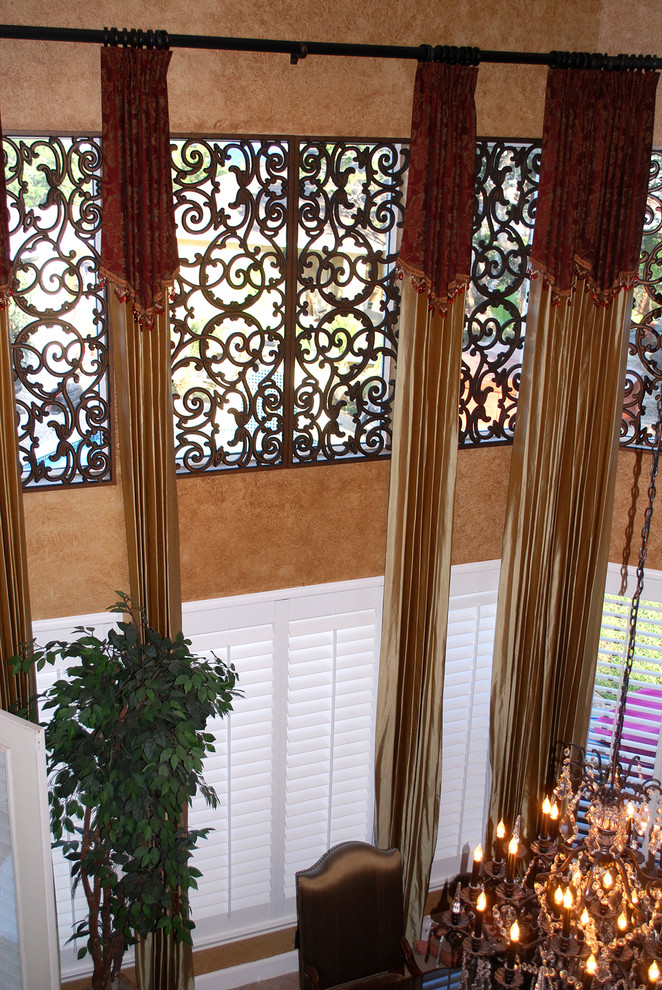 Mid-sized elegant enclosed dining room photo in Houston with brown walls