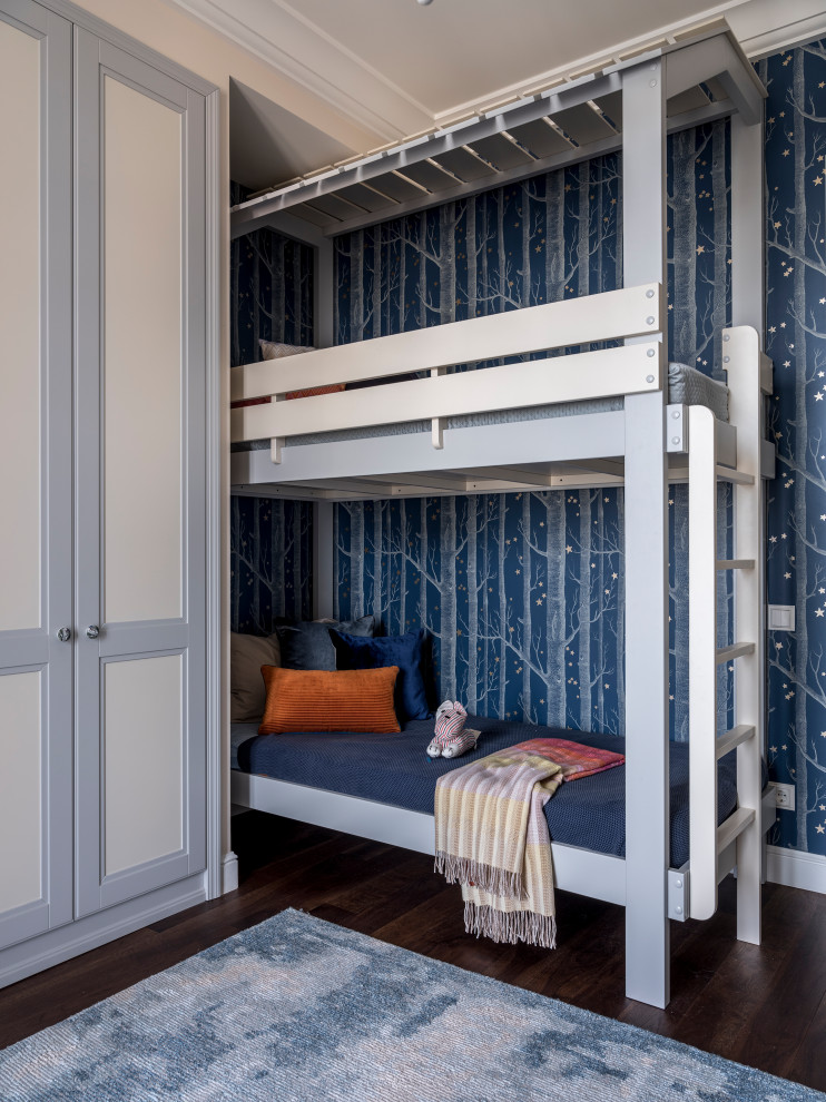 Photo of a transitional kids' bedroom for kids 4-10 years old in Moscow with blue walls, dark hardwood floors and wallpaper.