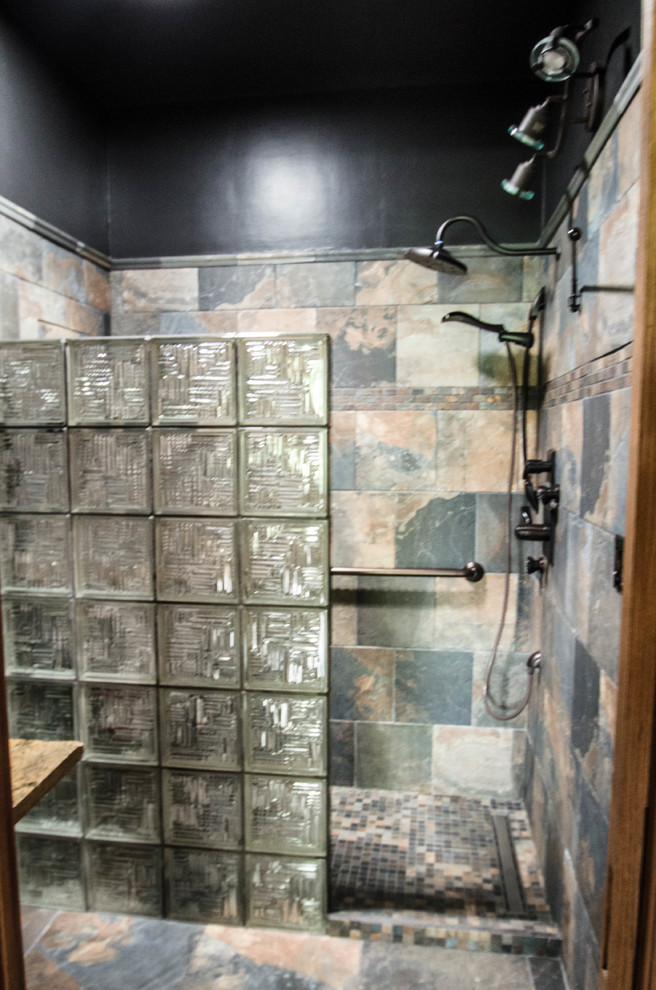 Mid-sized mountain style multicolored tile and slate tile slate floor and multicolored floor walk-in shower photo with black walls