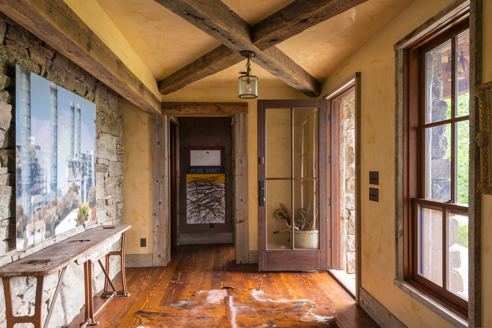 Country entryway in Other with beige walls, dark hardwood floors, a single front door and a glass front door.
