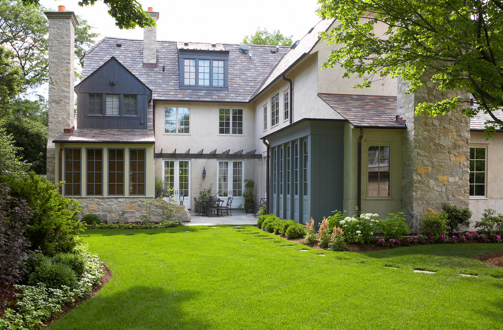 This is an example of a traditional exterior in Chicago with mixed siding.