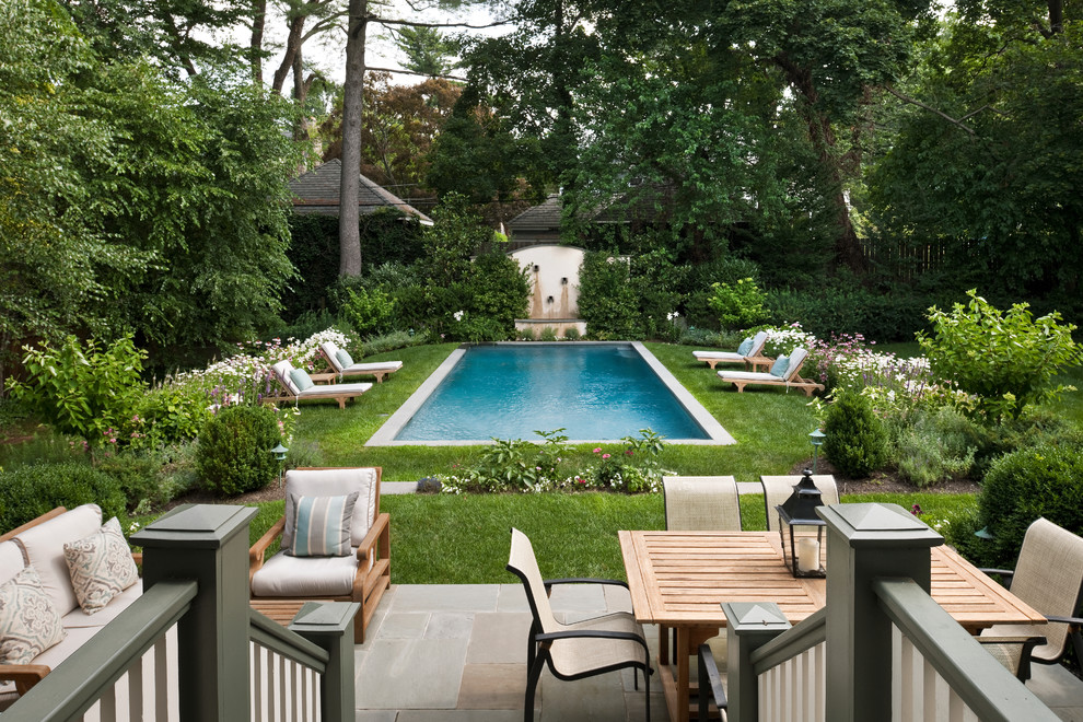 Inspiration for a traditional pool in Philadelphia with natural stone pavers.
