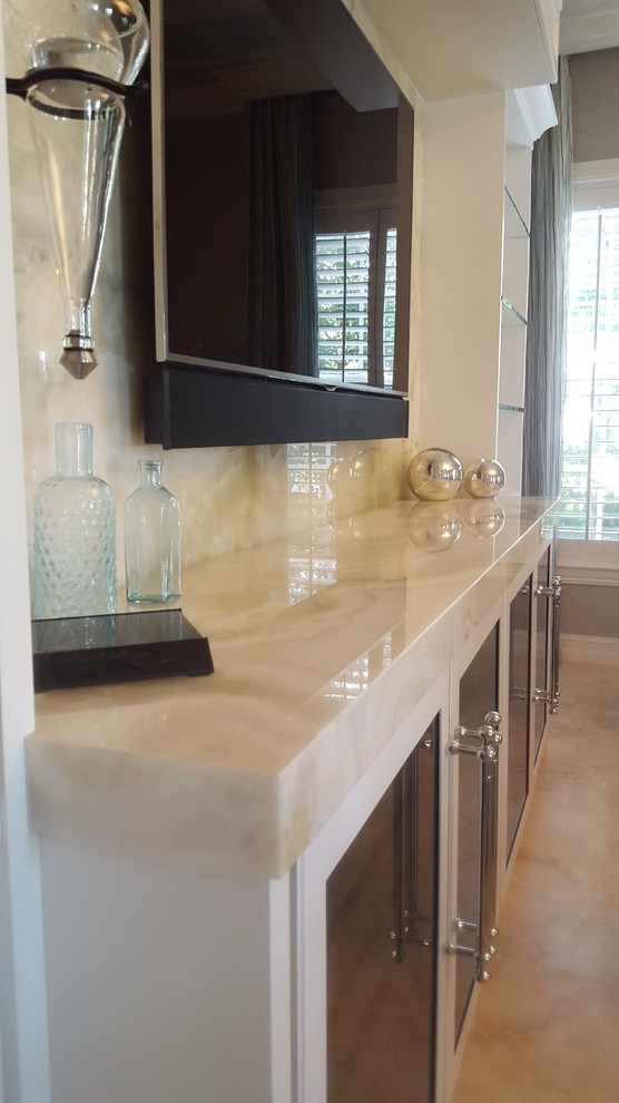 Example of a transitional home design design in Miami