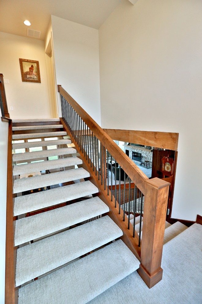 Photo of a mid-sized midcentury carpeted u-shaped staircase in Chicago with open risers.