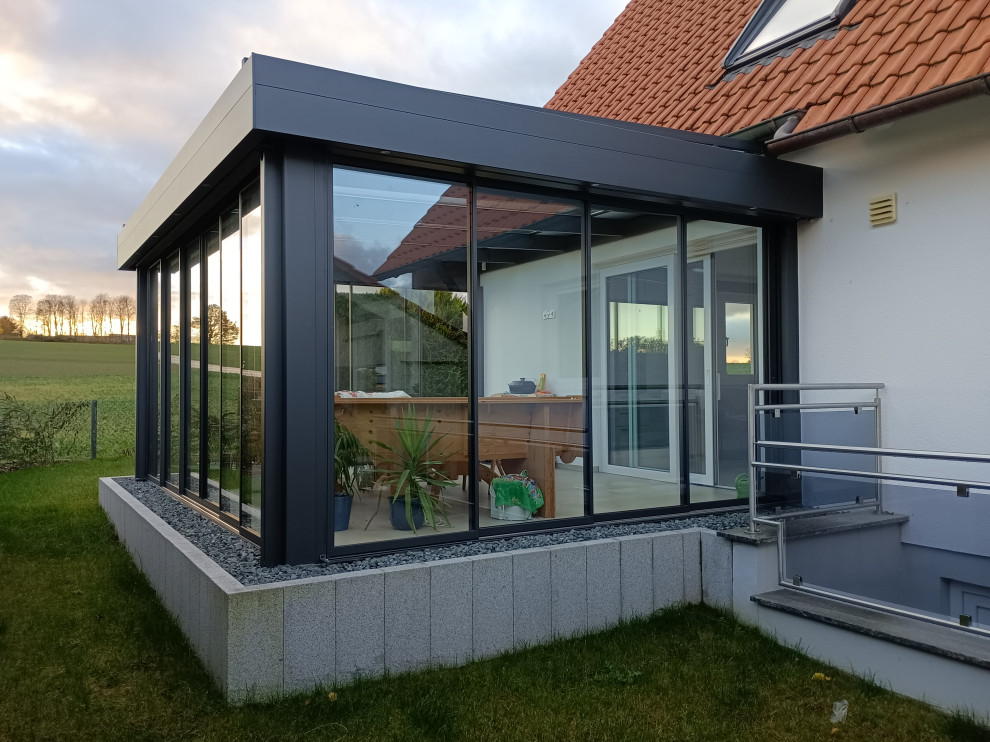 Photo of a medium sized contemporary conservatory in Munich.